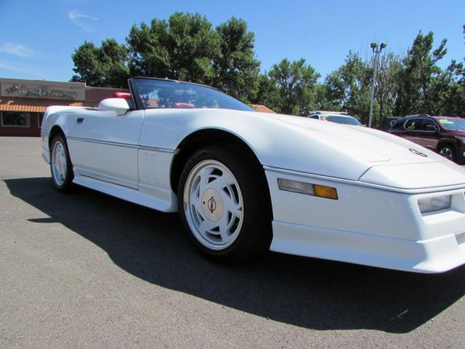 1989 White /Red Leather Chevrolet Corvette Convertible (1G1YY3184K5) with an 5.7L V8 OHV 16V engine, 6 speed manual transmission, located at 4562 State Avenue, Billings, MT, 59101, (406) 896-9833, 45.769516, -108.526772 - 1989 Chevrolet Corvette Convertible 6 speed manual - 13,219 miles!! 5.7L V8 OHV 16V engine - 6 speed manual transmission - 13,219 miles! Air conditioning - tilt and telescoping steering wheel - cruise control - Bose audio system - power windows and door locks - leather interior - dual power se - Photo #9