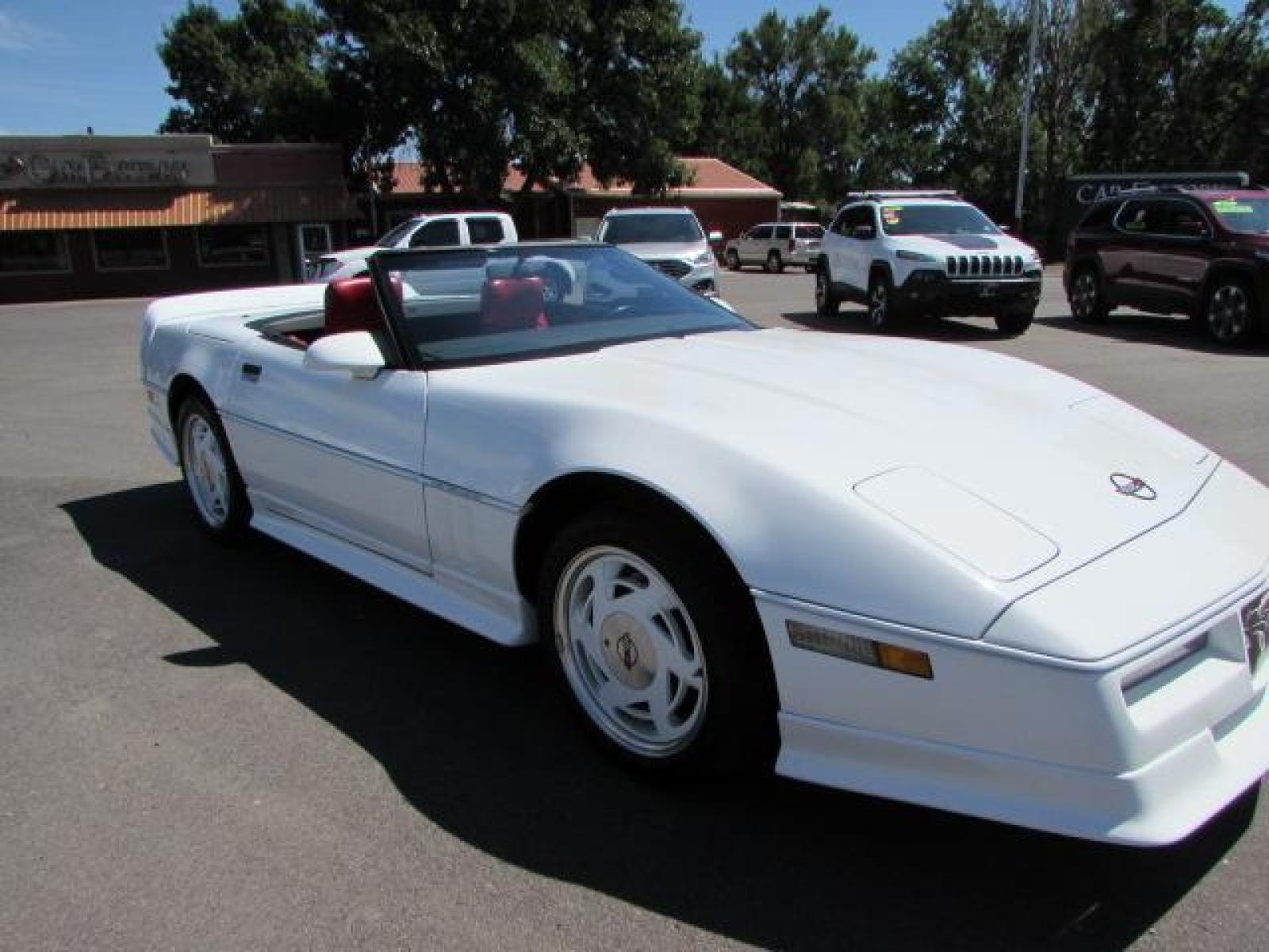 1989 White /Red Leather Chevrolet Corvette Convertible (1G1YY3184K5) with an 5.7L V8 OHV 16V engine, 6 speed manual transmission, located at 4562 State Avenue, Billings, MT, 59101, (406) 896-9833, 45.769516, -108.526772 - 1989 Chevrolet Corvette Convertible 6 speed manual - 13,219 miles!! 5.7L V8 OHV 16V engine - 6 speed manual transmission - 13,219 miles! Air conditioning - tilt and telescoping steering wheel - cruise control - Bose audio system - power windows and door locks - leather interior - dual power se - Photo #10