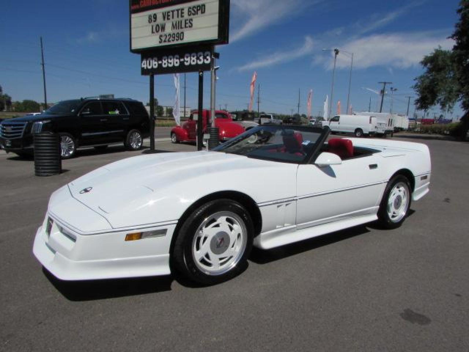 1989 White /Red Leather Chevrolet Corvette Convertible (1G1YY3184K5) with an 5.7L V8 OHV 16V engine, 6 speed manual transmission, located at 4562 State Avenue, Billings, MT, 59101, (406) 896-9833, 45.769516, -108.526772 - 1989 Chevrolet Corvette Convertible 6 speed manual - 13,219 miles!! 5.7L V8 OHV 16V engine - 6 speed manual transmission - 13,219 miles! Air conditioning - tilt and telescoping steering wheel - cruise control - Bose audio system - power windows and door locks - leather interior - dual power se - Photo #1