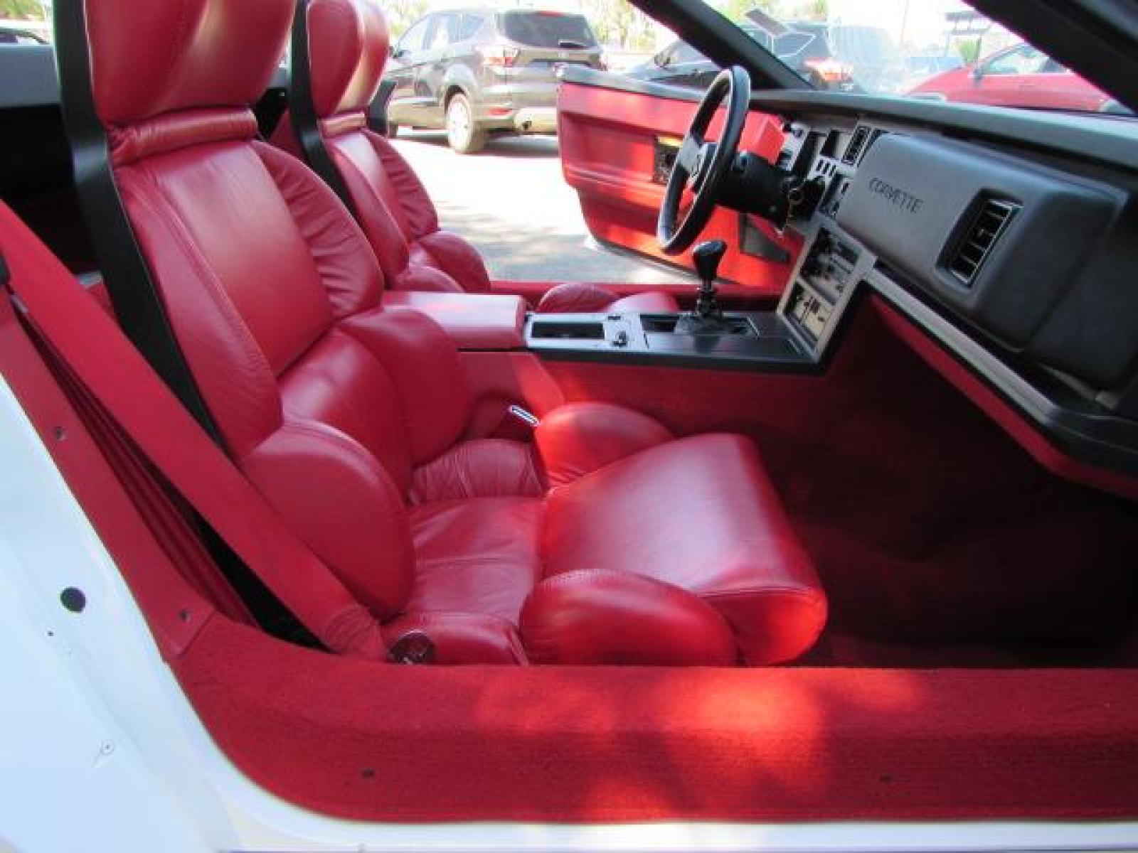 1989 White /Red Leather Chevrolet Corvette Convertible (1G1YY3184K5) with an 5.7L V8 OHV 16V engine, 6 speed manual transmission, located at 4562 State Avenue, Billings, MT, 59101, (406) 896-9833, 45.769516, -108.526772 - 1989 Chevrolet Corvette Convertible 6 speed manual - 13,219 miles!! 5.7L V8 OHV 16V engine - 6 speed manual transmission - 13,219 miles! Air conditioning - tilt and telescoping steering wheel - cruise control - Bose audio system - power windows and door locks - leather interior - dual power se - Photo #31