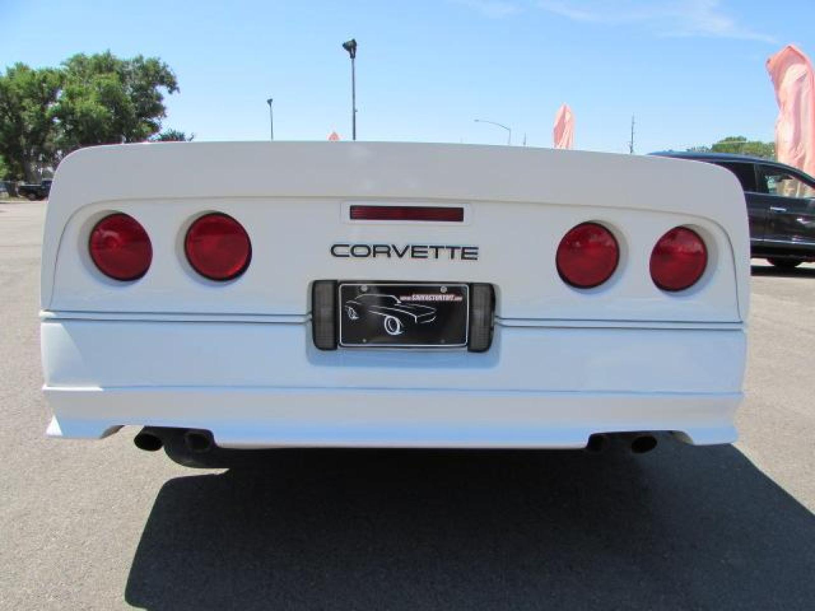 1989 White /Red Leather Chevrolet Corvette Convertible (1G1YY3184K5) with an 5.7L V8 OHV 16V engine, 6 speed manual transmission, located at 4562 State Avenue, Billings, MT, 59101, (406) 896-9833, 45.769516, -108.526772 - 1989 Chevrolet Corvette Convertible 6 speed manual - 13,219 miles!! 5.7L V8 OHV 16V engine - 6 speed manual transmission - 13,219 miles! Air conditioning - tilt and telescoping steering wheel - cruise control - Bose audio system - power windows and door locks - leather interior - dual power se - Photo #4