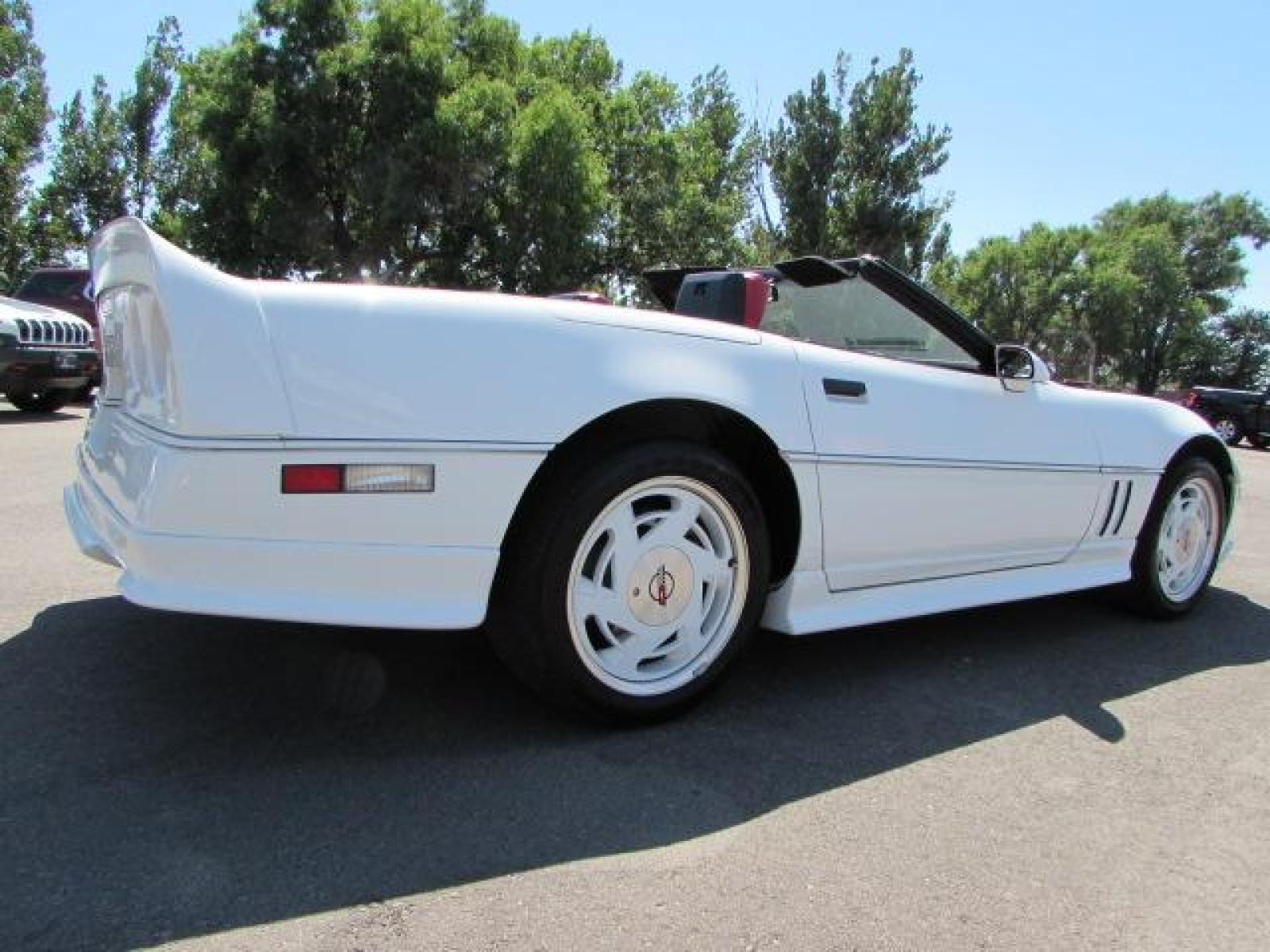 1989 White /Red Leather Chevrolet Corvette Convertible (1G1YY3184K5) with an 5.7L V8 OHV 16V engine, 6 speed manual transmission, located at 4562 State Avenue, Billings, MT, 59101, (406) 896-9833, 45.769516, -108.526772 - 1989 Chevrolet Corvette Convertible 6 speed manual - 13,219 miles!! 5.7L V8 OHV 16V engine - 6 speed manual transmission - 13,219 miles! Air conditioning - tilt and telescoping steering wheel - cruise control - Bose audio system - power windows and door locks - leather interior - dual power se - Photo #7