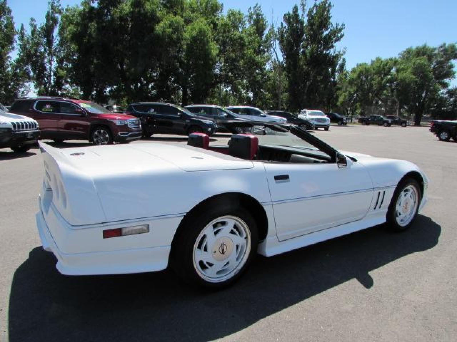 1989 White /Red Leather Chevrolet Corvette Convertible (1G1YY3184K5) with an 5.7L V8 OHV 16V engine, 6 speed manual transmission, located at 4562 State Avenue, Billings, MT, 59101, (406) 896-9833, 45.769516, -108.526772 - 1989 Chevrolet Corvette Convertible 6 speed manual - 13,219 miles!! 5.7L V8 OHV 16V engine - 6 speed manual transmission - 13,219 miles! Air conditioning - tilt and telescoping steering wheel - cruise control - Bose audio system - power windows and door locks - leather interior - dual power se - Photo #8