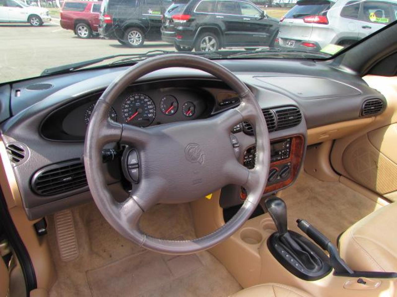 1999 Gold /Tan Leather Chrysler Sebring JXi (3C3EL55H6XT) with an 2.5L V6 SOHC 24V engine, 4-Speed Automatic Overdrive transmission, located at 4562 State Avenue, Billings, MT, 59101, (406) 896-9833, 45.769516, -108.526772 - 1999 Chrysler Sebring JXi Convertible 2.5L V6 SOHC 24V engine - 4-Speed Automatic Overdrive transmission - 73014 miles JXi package - air conditioning - tilt steering wheel - AM-FM-CD audio - power windows and door locks - power seat - leather interior - keyless entry - alloy wheels Runs an - Photo #13