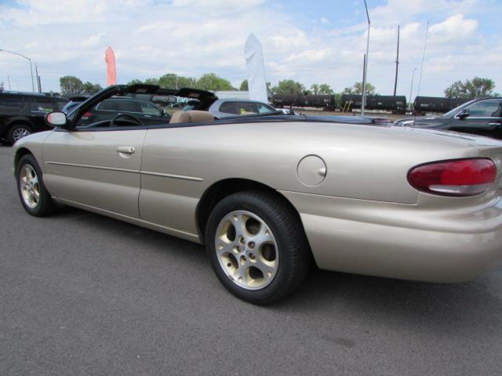 1999 Gold /Tan Leather Chrysler Sebring JXi (3C3EL55H6XT) with an 2.5L V6 SOHC 24V engine, 4-Speed Automatic Overdrive transmission, located at 4562 State Avenue, Billings, MT, 59101, (406) 896-9833, 45.769516, -108.526772 - 1999 Chrysler Sebring JXi Convertible 2.5L V6 SOHC 24V engine - 4-Speed Automatic Overdrive transmission - 73014 miles JXi package - air conditioning - tilt steering wheel - AM-FM-CD audio - power windows and door locks - power seat - leather interior - keyless entry - alloy wheels Runs an - Photo #1