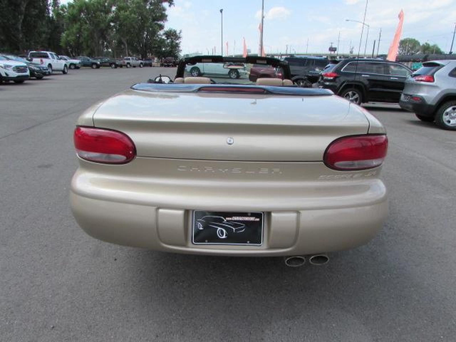 1999 Gold /Tan Leather Chrysler Sebring JXi (3C3EL55H6XT) with an 2.5L V6 SOHC 24V engine, 4-Speed Automatic Overdrive transmission, located at 4562 State Avenue, Billings, MT, 59101, (406) 896-9833, 45.769516, -108.526772 - 1999 Chrysler Sebring JXi Convertible 2.5L V6 SOHC 24V engine - 4-Speed Automatic Overdrive transmission - 73014 miles JXi package - air conditioning - tilt steering wheel - AM-FM-CD audio - power windows and door locks - power seat - leather interior - keyless entry - alloy wheels Runs an - Photo #2
