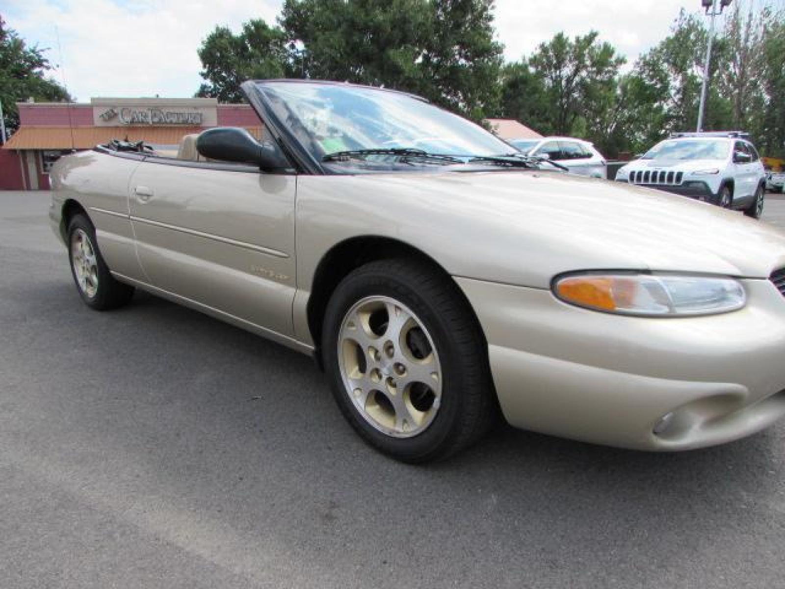 1999 Gold /Tan Leather Chrysler Sebring JXi (3C3EL55H6XT) with an 2.5L V6 SOHC 24V engine, 4-Speed Automatic Overdrive transmission, located at 4562 State Avenue, Billings, MT, 59101, (406) 896-9833, 45.769516, -108.526772 - 1999 Chrysler Sebring JXi Convertible 2.5L V6 SOHC 24V engine - 4-Speed Automatic Overdrive transmission - 73014 miles JXi package - air conditioning - tilt steering wheel - AM-FM-CD audio - power windows and door locks - power seat - leather interior - keyless entry - alloy wheels Runs an - Photo #5
