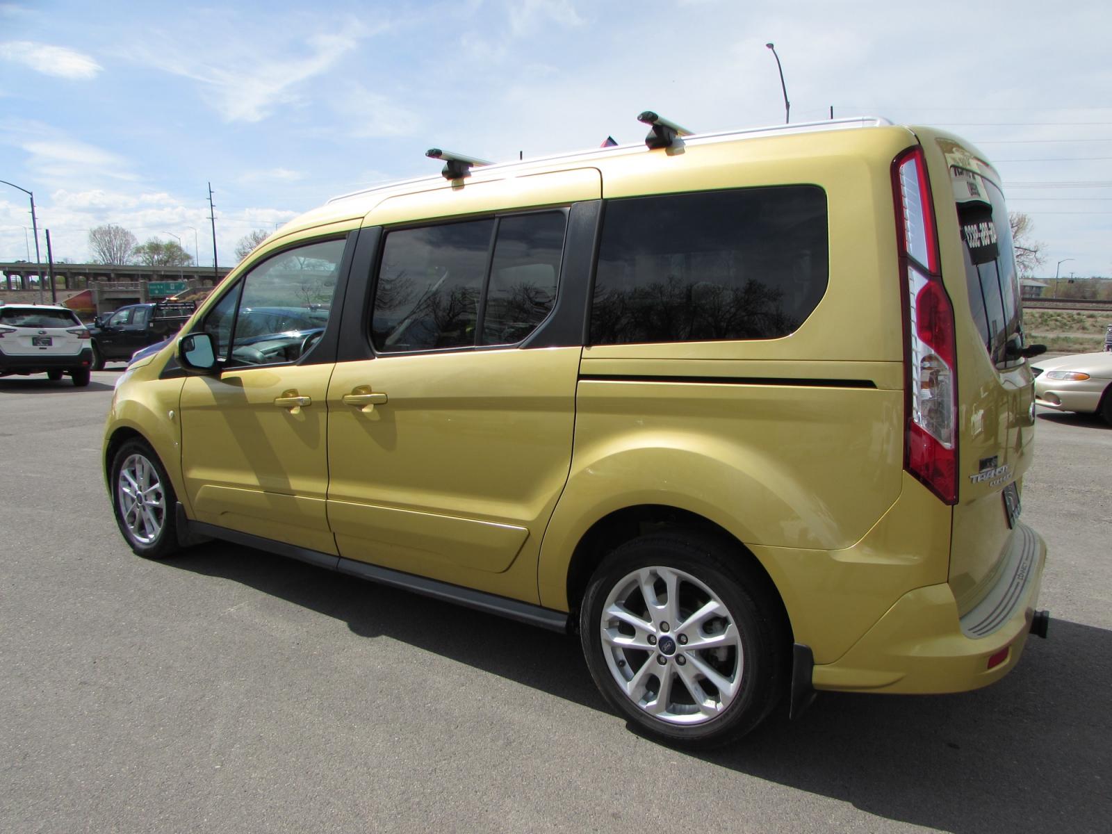 2014 Gold /Gray leather Ford Transit Connect Wagon Titanium w/Rear Liftgate LWB (NM0GE9G73E1) with an 2.5L L4 DOHC 16V engine, 6-Speed Automatic transmission, located at 4562 State Avenue, Billings, MT, 59101, (406) 896-9833, 45.769516, -108.526772 - 2014 Ford Transit Connect Wagon Titanium w/Rear Liftgate LWB - 7 passenger! 2.5L L4 DOHC 16V Engine - 6 speed automatic transmission with overdrive - front wheel drive - 90,290 miles Titanium package - air conditioning - tilt and telescoping steering wheel - cruise control - bluetooth audio w - Photo #1