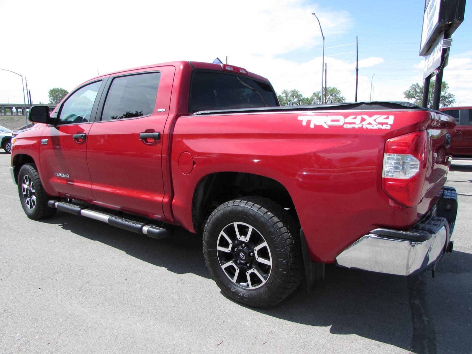 2016 Red /Gray cloth Toyota Tundra SR5 5.7L V8 FFV CrewMax 4WD (5TFDW5F15GX) with an 5.7L V8 DOHC 32V FFV engine, 6A transmission, located at 4562 State Avenue, Billings, MT, 59101, (406) 896-9833, 45.769516, -108.526772 - 2016 Toyota Tundra SR5 5.7L V8 FFV CrewMax 4WD - TRD Off Road! 5.7L V8 DOHC 32V Engine - 6 speed automatic overdrive transmission - 4WD - 183,940 miles - 5.5 Bed - SR5/TRD SR5 Upgrade Package - dual zone climate control - tilt and telescoping steering wheel - cruise control - touch screen blue - Photo #1