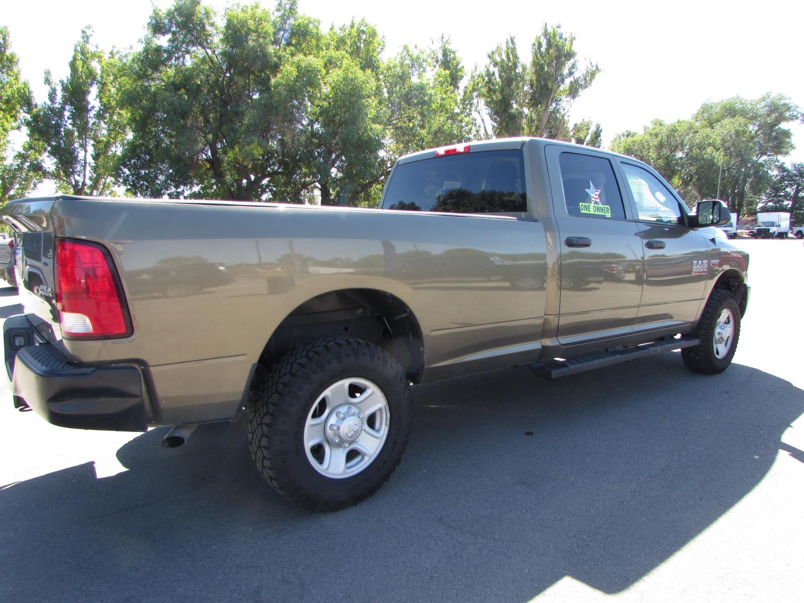 2015 Prairie Pearl /Gray RAM 3500 Tradesman Crew Cab 4WD (3C63R3GT6FG) with an 5.7L V8 OHV 16V engine, 6-Speed Automatic transmission, located at 4562 State Avenue, Billings, MT, 59101, (406) 896-9833, 45.769516, -108.526772 - 2015 RAM 3500 Tradesman Crew Cab 4WD - One owner - 63,672 miles! 5.7L V8 OHV 16V Hemi Engine - 6 speed automatic transmission - Longbox - 4WD - 63,672 miles - One owner Tradesman package - air conditioning - tilt steering wheel - cruise control - AM/FM/XM/CD audio - power windows and door loc - Photo #3