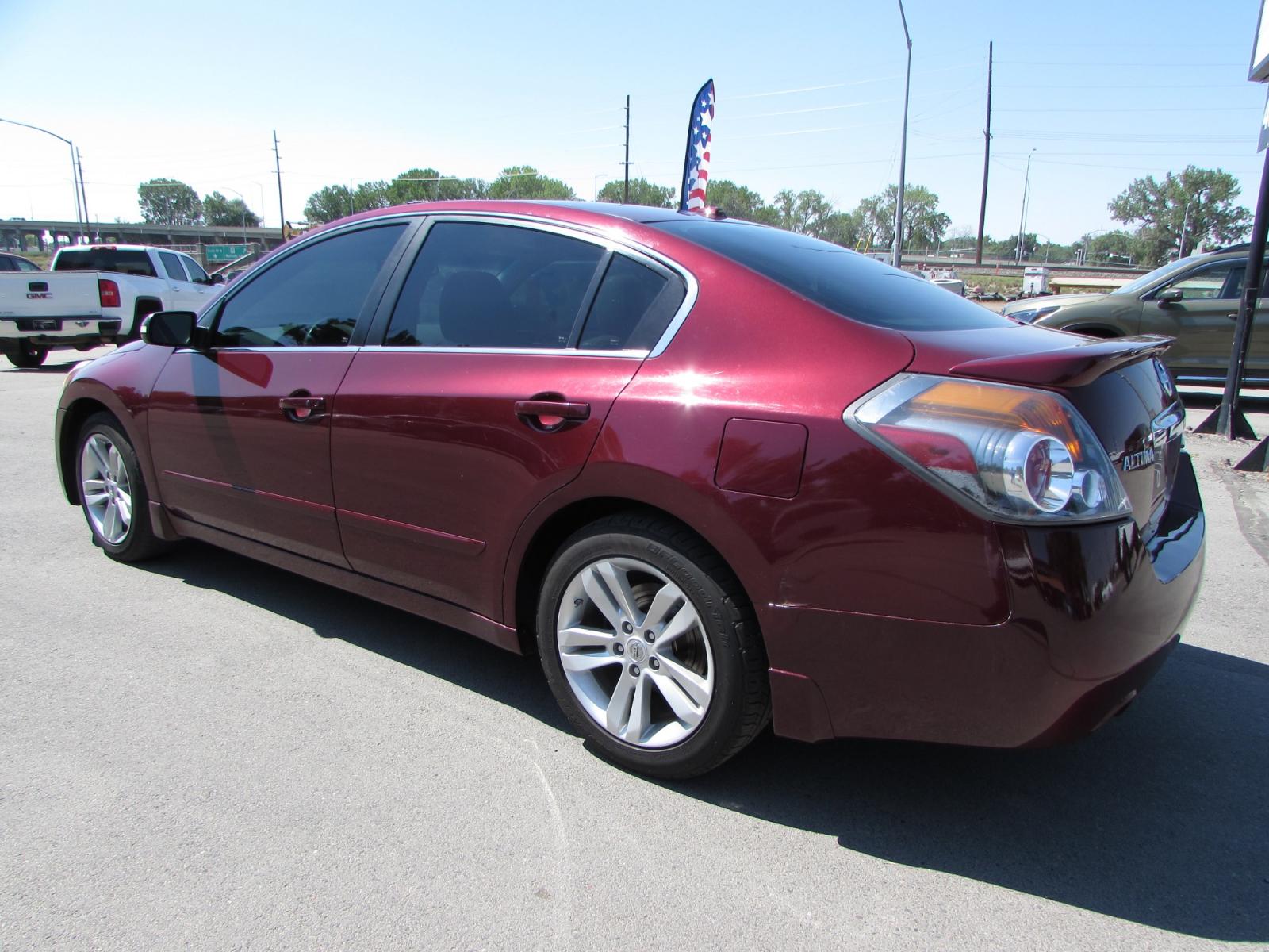 2011 Red /Tan Nissan Altima 3.5 SR (1N4BL2AP1BN) with an 3.5L V6 DOHC 24V engine, Continuously Variable Transmisson transmission, located at 4562 State Avenue, Billings, MT, 59101, (406) 896-9833, 45.769516, -108.526772 - 2011 Nissan Altima 3.5 SR - Leather/moonroof! 3.5L V6 DOHC 24V Engine - CVT automatic transmission - Front wheel drive - 125,051 miles - Inspected and serviced Inspected and serviced - copy of inspection and work performed as well as a complete history report provided! - SR package - clima - Photo #1