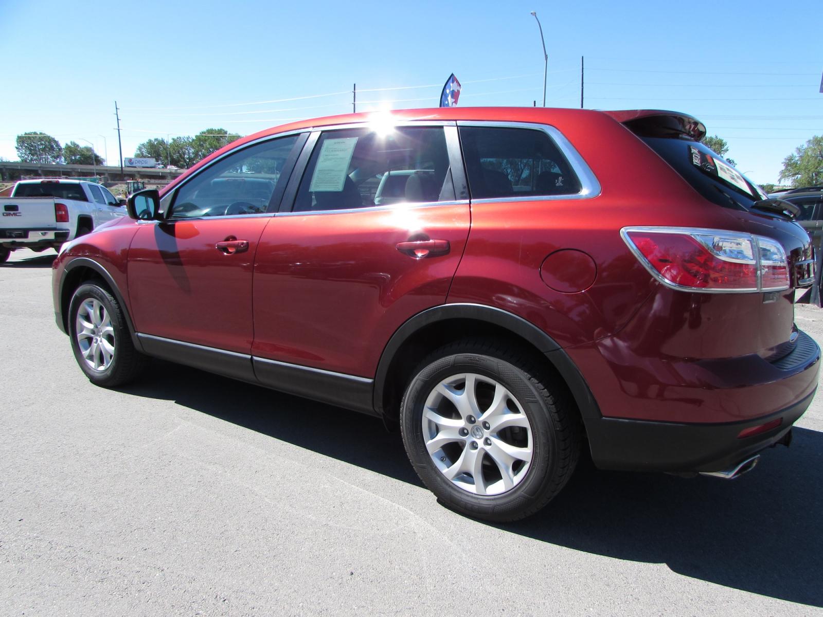 2011 Red /Gray Mazda CX-9 Touring AWD (JM3TB3CVXB0) with an 3.7L V6 DOHC 24V engine, 6-Speed Automatic transmission, located at 4562 State Avenue, Billings, MT, 59101, (406) 896-9833, 45.769516, -108.526772 - 2011 Mazda CX-9 Touring AWD - Moonroof - 3rd row seating! 3.7L V6 DOHC 24V engine - 6 speed automatic transmission - AWD - 106,244 miles Touring package - air conditioning - tilt wheel - cruise control - Bose touchscreen audio system with Bluetooth - power windows and door locks - power sunroo - Photo #1