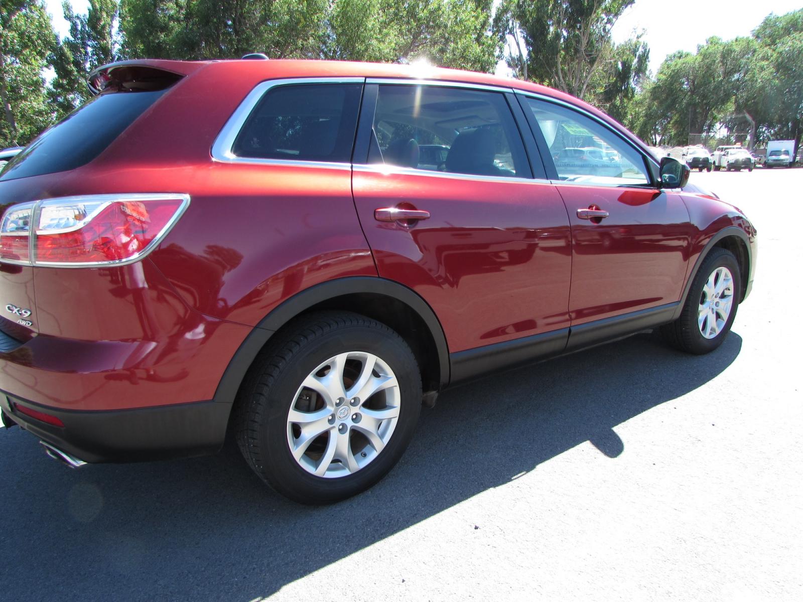 2011 Red /Gray Mazda CX-9 Touring AWD (JM3TB3CVXB0) with an 3.7L V6 DOHC 24V engine, 6-Speed Automatic transmission, located at 4562 State Avenue, Billings, MT, 59101, (406) 896-9833, 45.769516, -108.526772 - 2011 Mazda CX-9 Touring AWD - Moonroof - 3rd row seating! 3.7L V6 DOHC 24V engine - 6 speed automatic transmission - AWD - 106,244 miles Touring package - air conditioning - tilt wheel - cruise control - Bose touchscreen audio system with Bluetooth - power windows and door locks - power sunroo - Photo #3